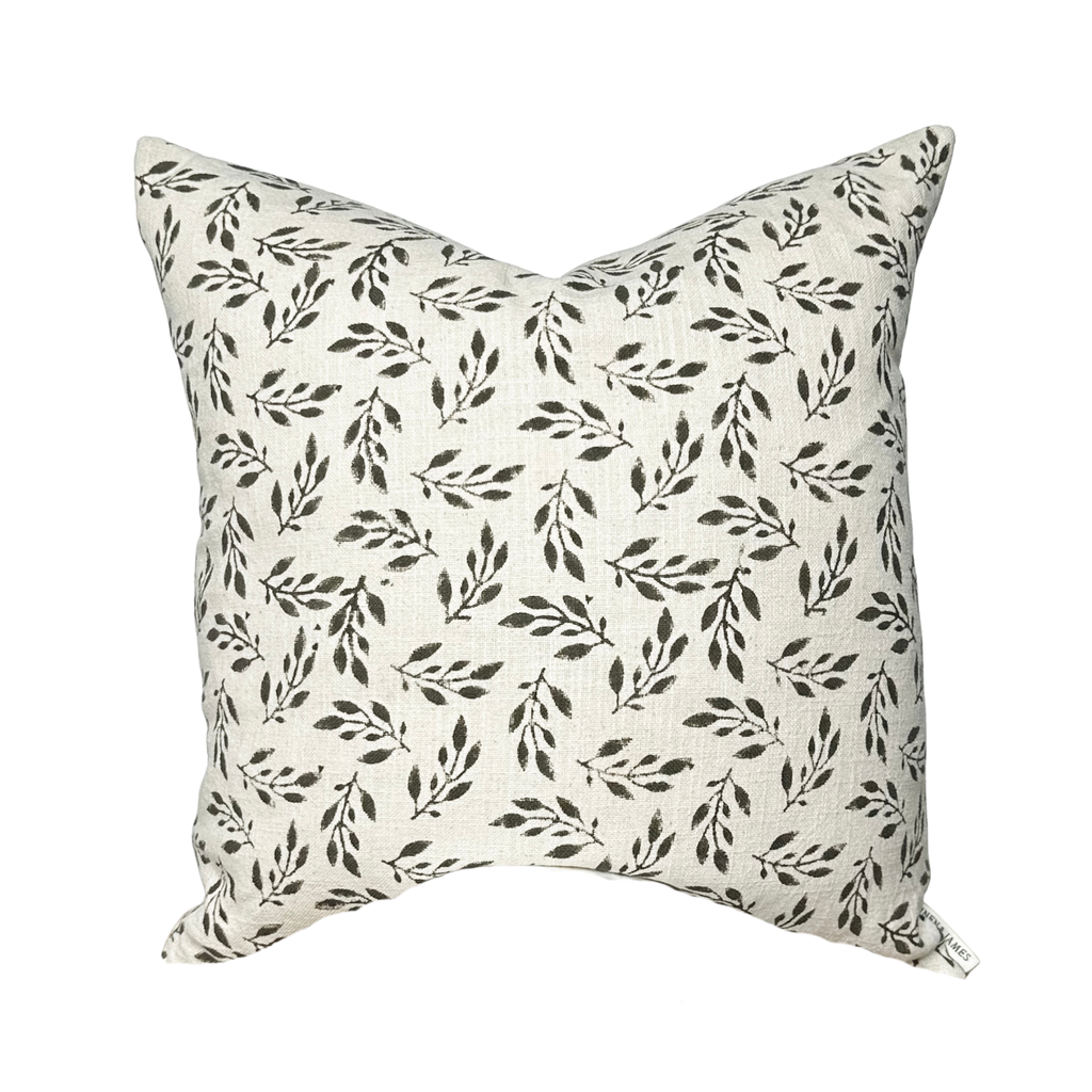 Decorative pillow with leaf pattern on a white background