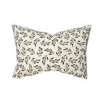 Decorative pillow with leaf pattern on a white background
