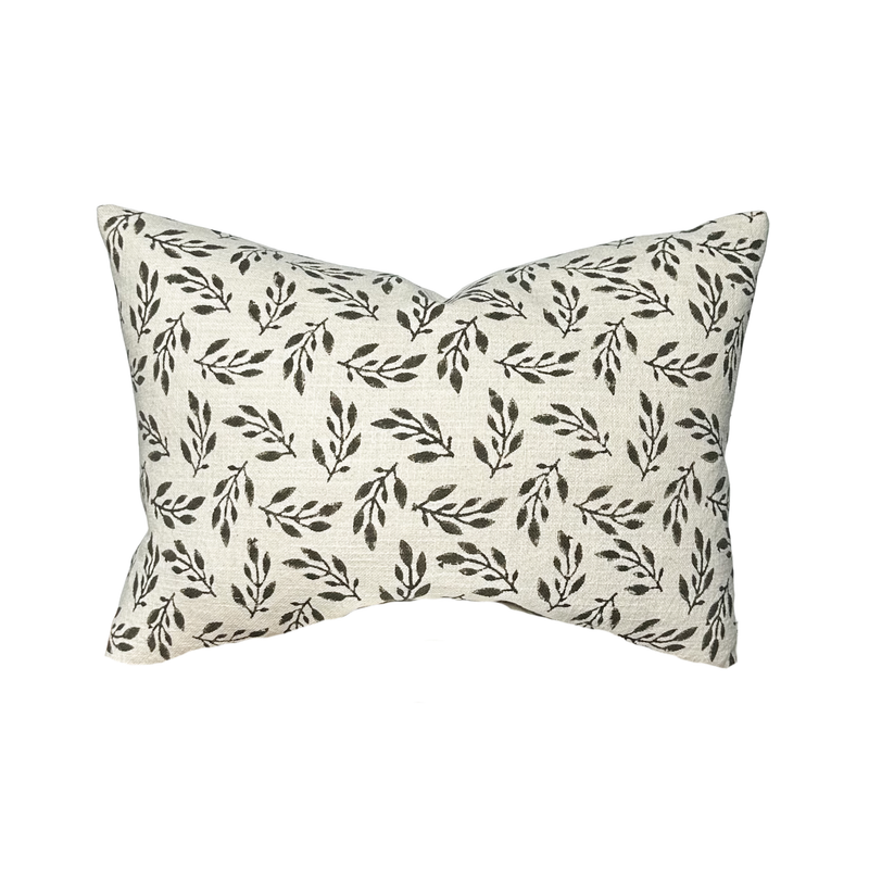 Decorative pillow with leaf pattern on a white background