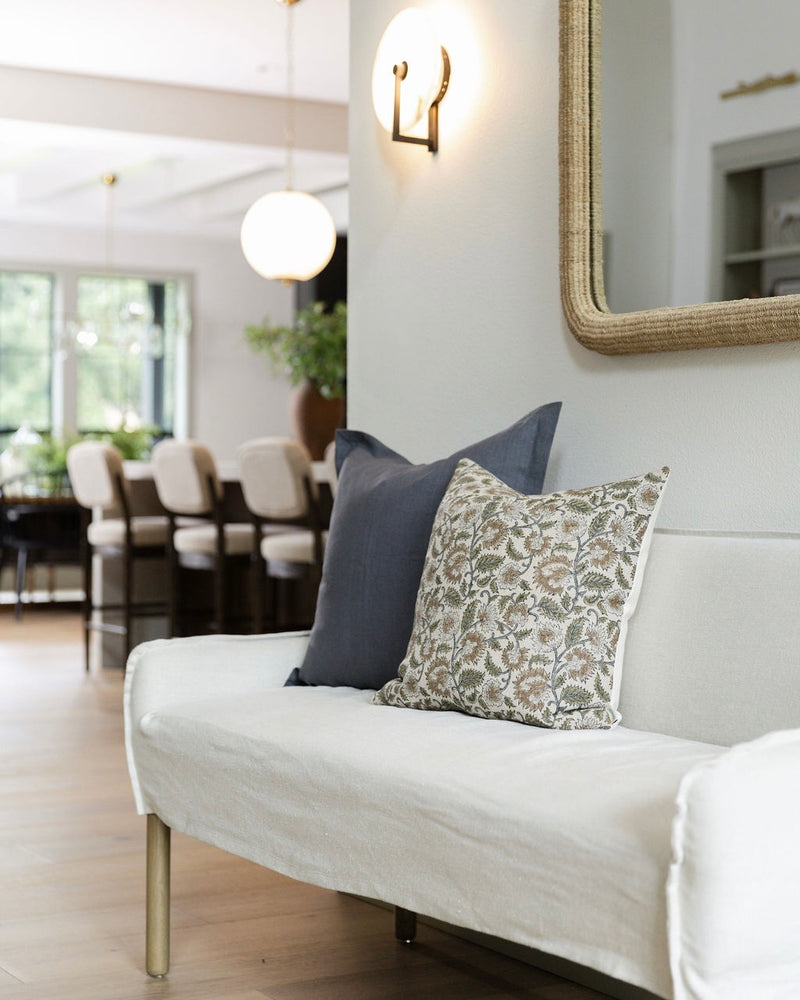 White sofa with decorative pillows in a living room setting
