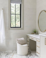 Modern bathroom with vanity, mirror, and window