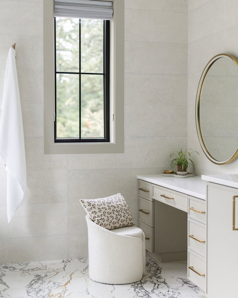 Modern bathroom with vanity, mirror, and window