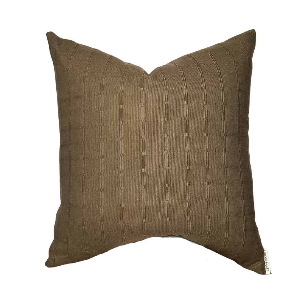 Brown textured pillow on a white background